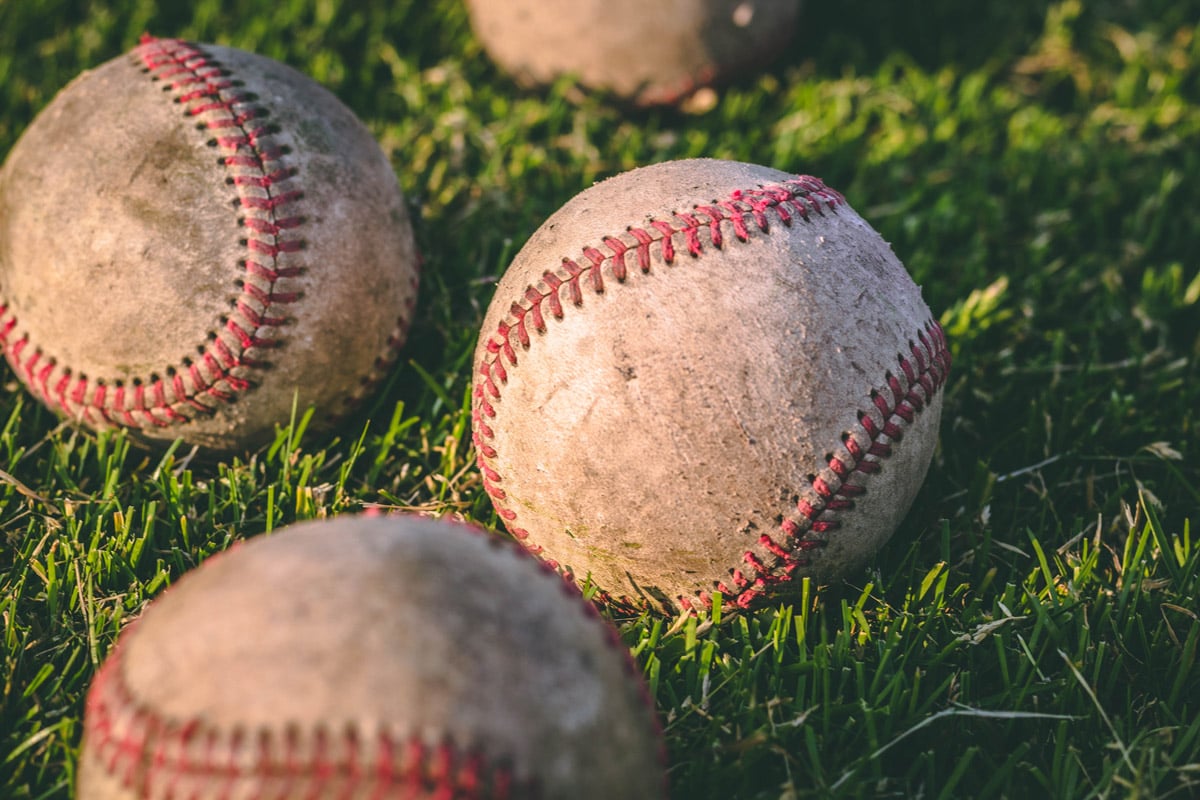 closeup-baseballs-on-grass