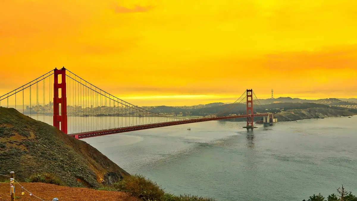 San Francisco Golden Gate bridge with golden yellow sky background
