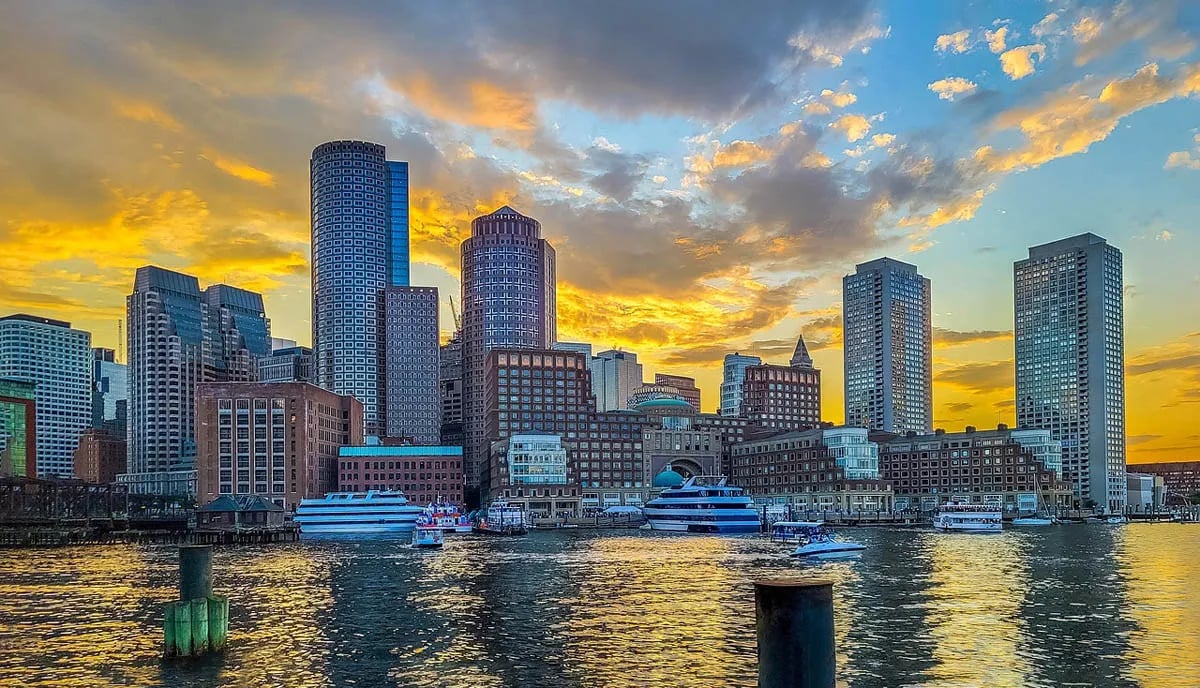Boston harbor skyline at sunset