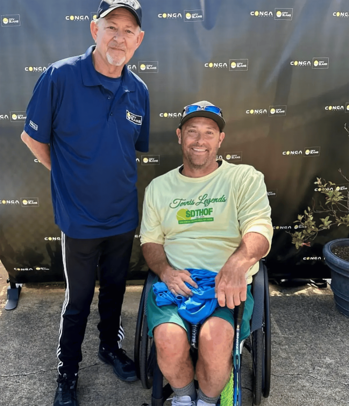 Rich Neher and David Wagner, wheelchair tennis player, posing for a pic