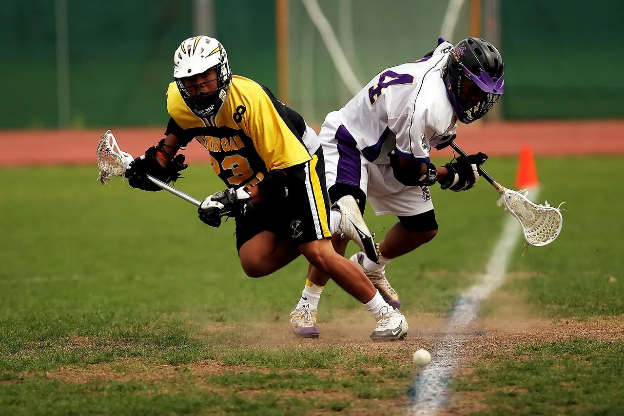 mens field lacrosse players going for ball