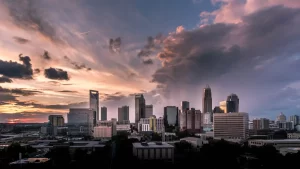 charlotte skyline at sunrise with clouds across the sky