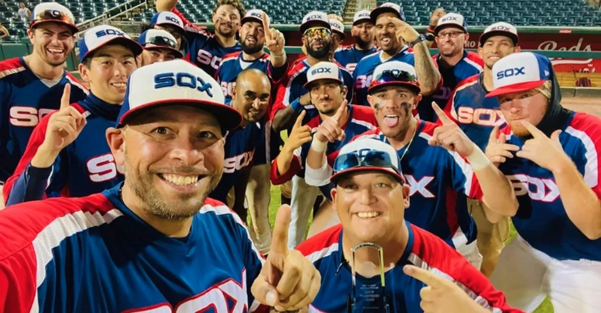 Group photo of NABA adult baseball tournament championship team with guys pointing fingers displaying #1