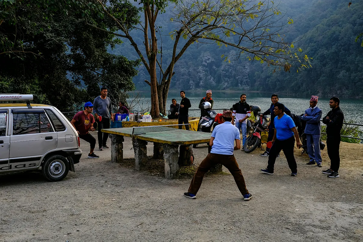 ping pong game in a mountain lake setting 1