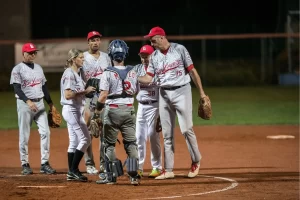 softball team gathered on pitchers mound