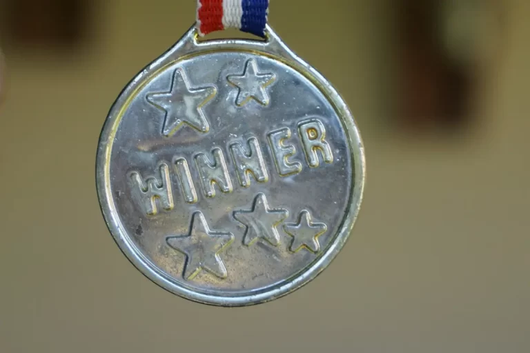 close of of medal that says "winner"