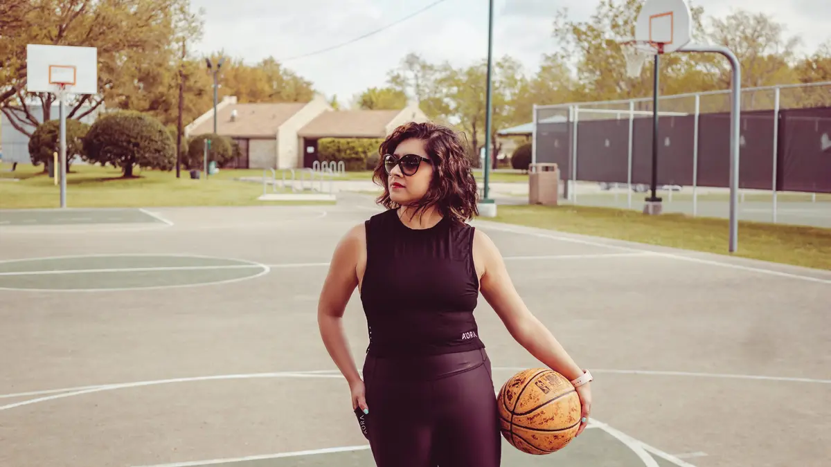 woman holding basketball